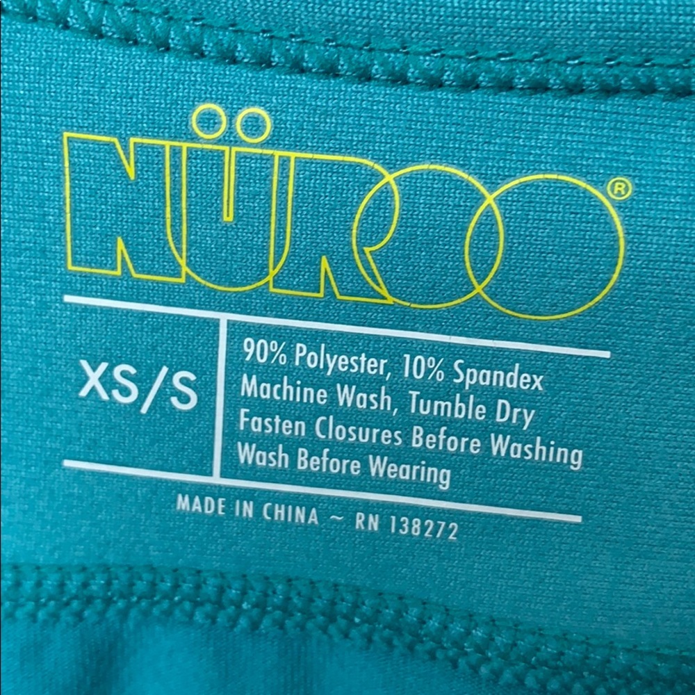 Nuroo baby wearing shirt
